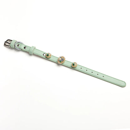 Vintage Bloom snap-on charm set on Mist green leather collar by Vanderclix&Co., angled view.