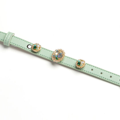 Green dog collar with floral vintage charms by Vanderclix&Co., detail view.