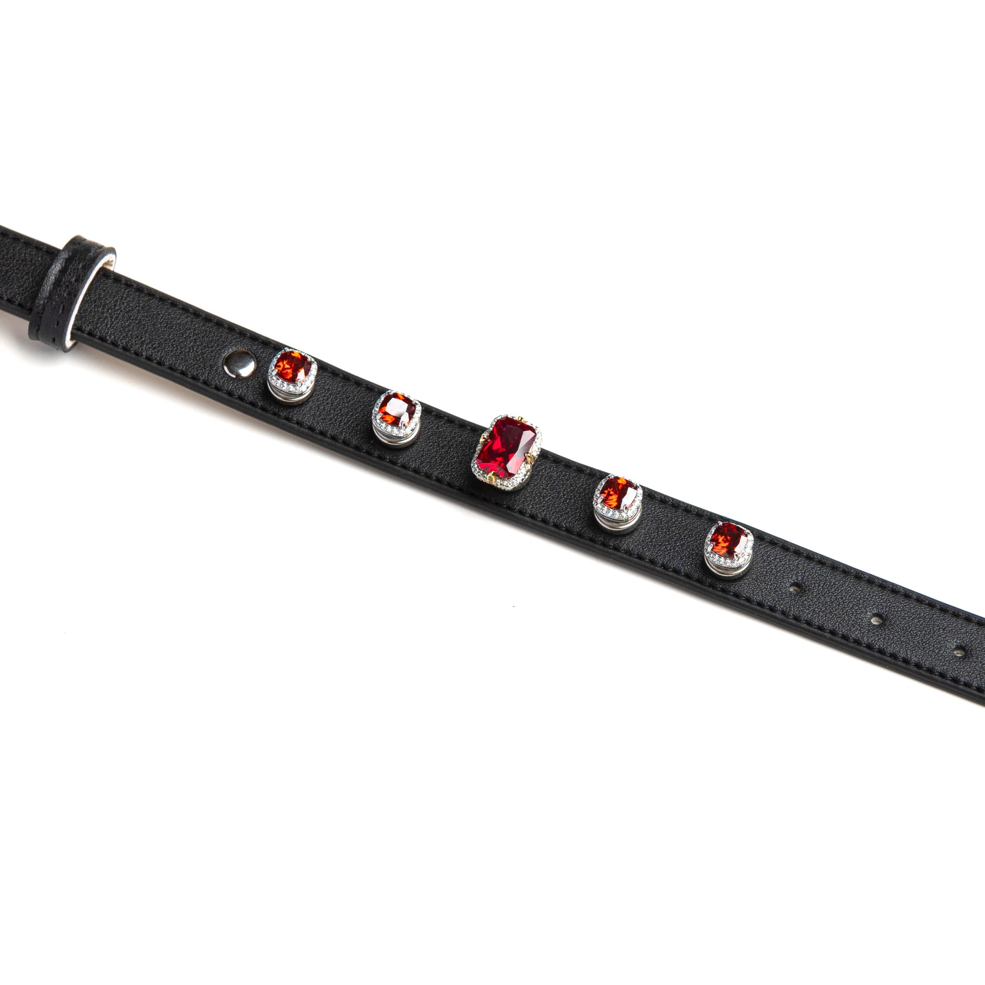 Black dog collar with deep red and orange gem charms by Vanderclix&Co., detail view.