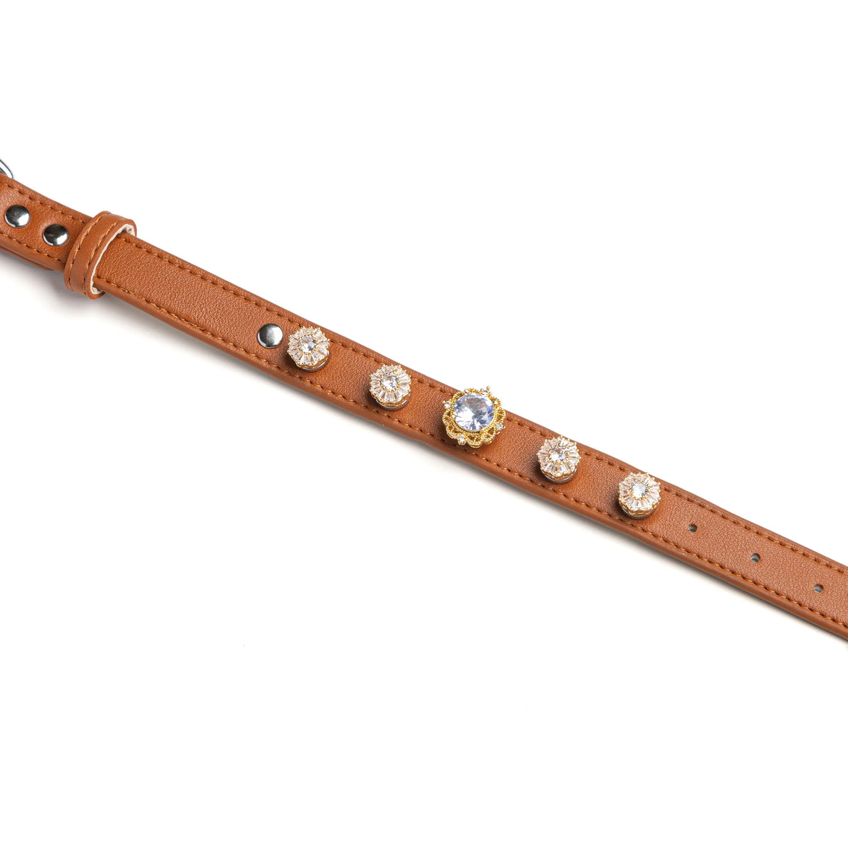 Brown dog collar with snowflake crystal and diamond-center charms by Vanderclix, detail view.