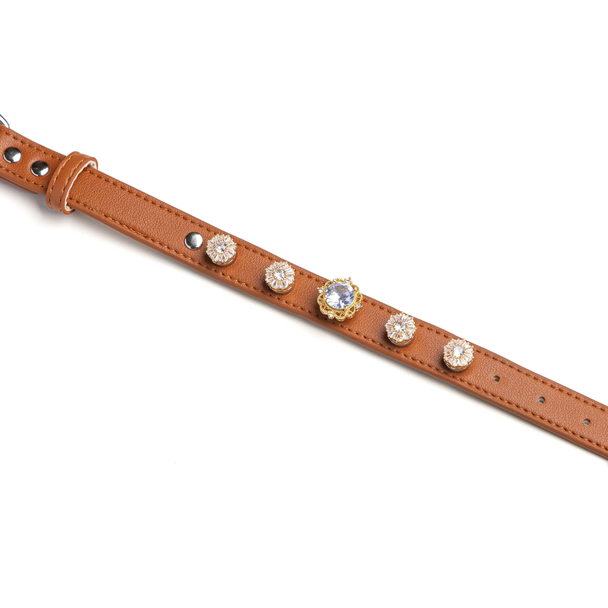 Brown dog collar with snowflake crystal and diamond-center charms by Vanderclix&Co., detail view.