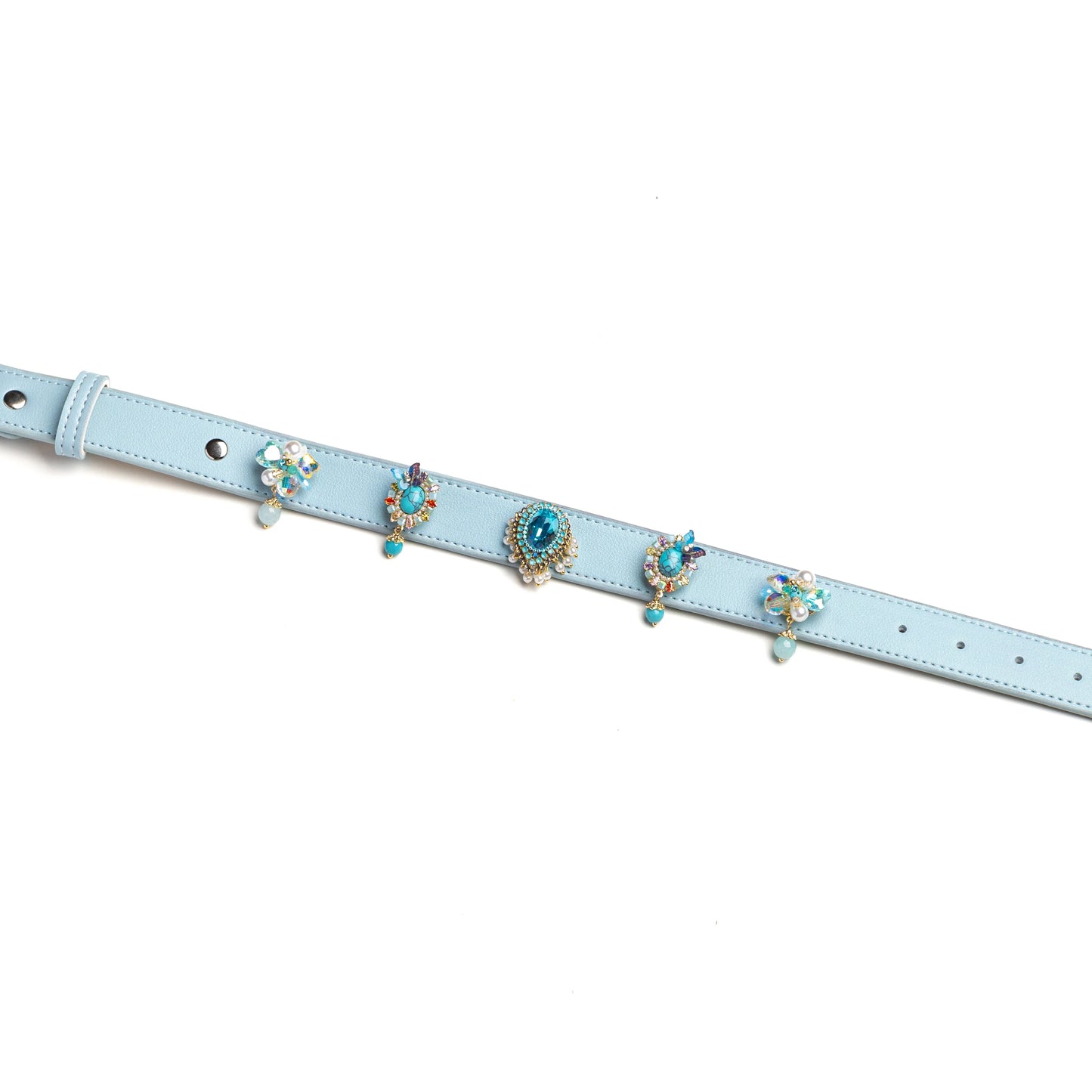 Blue dog collar with layered decorative gem charms by Vanderclix&Co., detail view.
