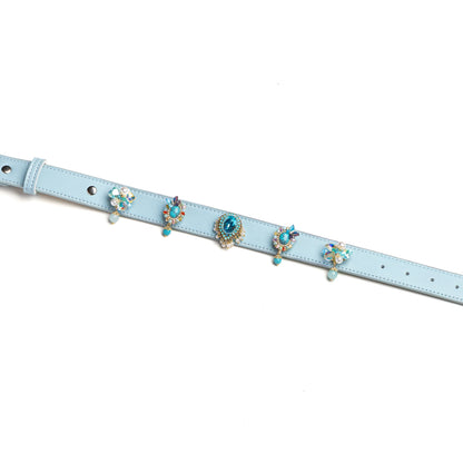 Blue dog collar with layered decorative gem charms by Vanderclix&Co., detail view.